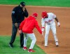 Philadelphia Phillies' Andrew McCutchen (22) and manager Joe Girardi dispute a call at second base with umpire Phil Cuzzi (10) during the seventh inning of a baseball game against the New York Mets, Saturday, May 1, 2021, in Philadelphia. McCutchen was called out on the play. (AP Photo/Laurence Kesterson)