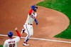 Philadelphia Phillies' Bryce Harper, right, reacts with third base coach Dusty Wathan after hitting a two-run home run off Toronto Blue Jays pitcher Robbie Ray during the fifth inning of the first baseball game in a doubleheader, Friday, Sept. 18, 2020, in Philadelphia. (AP Photo/Matt Slocum)