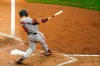 Baltimore Orioles' Anthony Santander follows through after hitting a three-run double off Philadelphia Phillies pitcher Jake Arrieta during the fifth inning of a baseball game, Thursday, Aug. 13, 2020, in Philadelphia. (AP Photo/Matt Slocum)