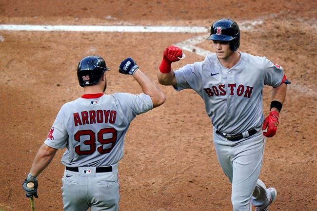 Boston Red Sox's Bobby Dalbec, right, and Christian Arroyo celebrate after Dalbec's home run off Philadelphia Phillies pitcher Tommy Hunter during the sixth inning of the first baseball game in a doubleheader, Tuesday, Sept. 8, 2020, in Philadelphia. (AP Photo/Matt Slocum)