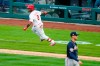 Philadelphia Phillies' Jean Segura, left, reacts after hitting a game-winning RBI-single off Atlanta Braves relief pitcher Nate Jones during the 10th inning of an opening day baseball game, Thursday, April 1, 2021, in Philadelphia. (AP Photo/Matt Slocum)