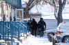 Daniel Crump / Winnipeg Free Press
Members of the Winnipeg Police Service on scene in the 600 block of McGee Street. Three men were taken into custody — including a man wanted for second-degree murder in an October homicide.