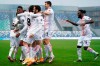 AC Milan's Rafael Leao, left, celebrates with his teammates after scoring his side's opening goal during the Serie A soccer match between Sassuolo and AC Milan at the Mapei Stadium in Reggio Emilia, Italy, Sunday, Dec. 20, 2020. (Spada/LaPresse via AP)