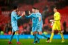 Burnley's Dwight McNeil, left, and Matthew Lowton celebrate at the end of the Premier League match at Old Trafford, Manchester Wednesday January 22, 2020. (Martin Rickett/PA via AP)