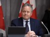 Bank of Canada Governor Stephen Poloz listens to a question at a press conference on Parliament Hill in Ottawa, on Wednesday, March 18, 2020. Canada's central bank will make an announcement today on its key interest rate and detail the impact of COVID-19 on the national economy. THE CANADIAN PRESS/Justin Tang
