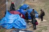 Park residents gather at an encampment outside Sanctuary Ministries in Toronto on Monday, May 4, 2020. Physical distancing will now be standard in Toronto's shelter system during the COVID-19 pandemic after the city settled with a group of advocates for the homeless who took it to court.THE CANADIAN PRESS/Frank Gunn