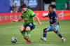 Seattle Sounders defender Shane O'Neill (27) controls a ball in front of Vancouver Whitecaps forward Yordy Reyna (29) during the second half of an MLS soccer match, Sunday, July 19, 2020, in Kissimmee, Fla.The depleted Whitecaps wrap up group play at the MLS is Back Tournament on Thursday, knowing a big win over Chicago Fire SC could keep them at the tournament. THE CANADIAN PRESS/AP/Phelan M. Ebenhack