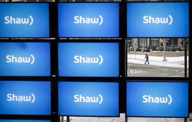 Shaw logos are on display at the company's annual meeting in Calgary, Jan. 17, 2019. The owner of Freedom Mobile has disclosed details of a new wireless service called Shaw Mobile, which will be in Alberta and British Columbia. THE CANADIAN PRESS/Jeff McIntosh