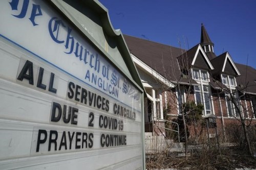 A sign announces all services have been cancelled due to COVID-19 at St. Saviour's Anglican Church in Toronto on Sunday, March 15, 2020. Most Anglican churches and some United churches will be reopening for in-building services this Sunday after spending the summer practising their faith online. The United and Anglican churches, Ontario's second and third largest Christian denominations respectively, have found balancing theological beliefs, public outreach programs, and safety protocols to be a challenge. THE CANADIAN PRESS/Frank Gunn