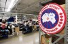 Employees work on Canada Goose jackets at the Canada Goose factory in Toronto on Thursday, April 2, 2015. Canada Goose Holdings Inc. says it will start using reclaimed fur to make its luxury coats and stop purchasing new fur some time in 2022. THE CANADIAN PRESS/Nathan Denette