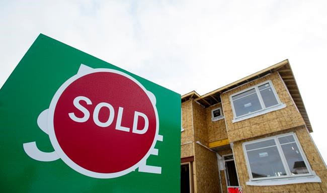A sold sign is shown in a housing development in Beckwith, Ont., on Wednesday, Jan. 11, 2018. Canada Mortgage and Housing Corp. is expanding its insured mortgage purchase program to $150 billion.THE CANADIAN PRESS/Sean Kilpatrick