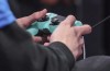 A contestant toggles a game controller, Wednesday, July 24, 2019, in Queens borough of New York. The Vancouver Whitecaps announced Thursday it has partnered with Alpha North Esports & Entertainment, to become the club's official online esports tournament platform. Vancouver-based Alpha North describes itself as an 