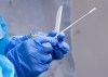 A health-care worker prepares a swab at a temporary COVID-19 test clinic in Montreal, on Friday, May 15, 2020. THE CANADIAN PRESS/Paul Chiasson