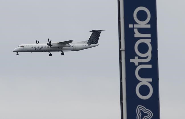 A Porter airplane lands in Toronto on Wednesday, March 18, 2020. Porter Airlines is extending the suspension of all its flights until the end of August. THE CANADIAN PRESS/Nathan Denette
