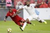 Toronto FC's Richie Laryea (22) falls as he and Colorado Rapids midfielder Kellyn Acosta (10) vie for the ball in the second half of MLS action at BMO Field in Toronto, Sunday, Sept. 15 2019. Canadian internation Laryea has signed a new contract with Toronto FC after making his mark with the MLS club last season. THE CANADIAN PRESS/Cole Burston