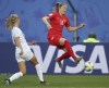 Canada's Janine Beckie, right, jumps to reach the ball during the Women's World Cup Group E soccer match between Canada and New Zealand in Grenoble, France, Saturday, June 15, 2019. Canadian international Beckie has signed a two-year contract extension with Manchester City. The 25-year-old's current deal was to expire at the end of June. THE CANADIAN PRESS/AP/Francisco Seco