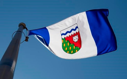 The Northwest Territories provincial flag flies on a flag pole in Ottawa, Monday July 6, 2020. People in the Northwest Territories who want to be organ donors can now do so through Alberta's registry. THE CANADIAN PRESS/Adrian Wyld