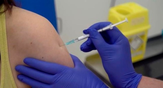 A screen grab taken from a video issued by Britain's Oxford University shows a person being injected as part of the first human trials in the United Kingdom to test a potential coronavirus vaccine, by Oxford University in England, Thursday April 23, 2020. While researchers across the planet race to find a vaccine for COVID-19, a new poll suggests Canadians are divided over whether getting it should be mandatory or voluntary. THE CANADIAN PRESS/HO-AP-Oxford University Pool via AP