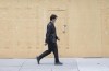 A man walks by a boarded-up storefront in Montreal, Sunday, May 3, 2020, as the COVID-19 pandemic continues in Canada and around the world. THE CANADIAN PRESS/Graham Hughes