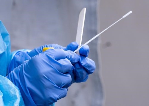 A nurse gets a swab ready at a temporary COVID-19 test clinic in Montreal, on Friday, May 15, 2020. An ad-hoc transparency group is calling on governments to make crucial records related to the COVID-19 pandemic open by default as a measure of accountability to Canadians. THE CANADIAN PRESS/Paul Chiasson