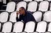FILE - In this Saturday, Aug. 1, 2020 filer, Juventus' head coach Maurizio Sarri smokes during a Serie A soccer match between Juventus and Roma, at the Allianz stadium in Turin, Italy. Cristiano Ronaldo scored twice but could not prevent Juventus from going out of the Champions League despite a 2-1 victory over Lyon in its rearranged second-leg match Friday. The French team progressed to the quarterfinals on away goals after a 2-2 draw on aggregate. (AP Photo/Luca Bruno, File)