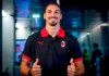 Zlatan Ibrahimovic gives the thumbs up as he poses for the media upon his arrival at Linate airport, near Milan, northern Italy, Saturday, Aug. 29, 2020. Ibrahimovic returned to Milan ready to sign a new contract with AC Milan. The 38-year-old Ibrahimovic is expected to sign a one-season deal worth 7 million euros ($8.3 million). (Claudio Furlan/LaPresse via AP)