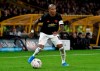 FILE - Saturday, Jan. 4, 2020 file photo, Manchester United's Ashley Young controls the ball during a English FA Cup third round soccer match in Wolverhampton, England. Manchester United captain Ashley Young is nearing a transfer to Inter Milan, United coach Ole Gunnar Solskjaer said Friday, Jan. 17, 2020, as the fullback was seen entering a medical in Italy.(AP Photo/Rui Vieira, File)