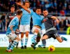 Udinese's Ilija Nestorovski, right, prepares to kick the ball during the Italian Serie A soccer match between Lazio and Udinese at the Olympic stadium in Rome, Sunday, Dec. 1, 2019. (Angelo Carconi/ANSA via AP)