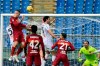 Roma's Gianluca Mancini, top left, scores his side's opening goal during the Serie A soccer match between Roma and Genoa at the Rome Olympic Stadium Sunday, March 7, 2021. (Alfredo Falcone/LaPresse via AP)
