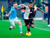 Lazio's Manuel Lazzari, left, challenges Juventus' Alex Sandro during the Italian Serie A soccer match between Lazio and Juventus at the Olympic stadium in Rome, Saturday, Dec. 7, 2019. (Ettore Ferrari/ANSA via AP)