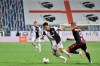Juventus' Cristiano Ronaldo, center, and Cagliari's Marko Rog, right, compete for the ball during a Serie A soccer match between Cagliari and Juventus, at the Sardegna Arena stadium, in Cagliari, Italy, Wednesday, July 29, 2020. (Alessandro Tocco/LaPresse via AP)