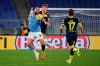 Lazio's Vedat Muriqi, left, and Parma's Daan Dierckx, compete for the ball during the Italian Cup, quarterfinal soccer match between Lazio and Parma, at the Rome Olympic Stadium Thursday, Jan. 21, 2021. (Alfredo Falcone/LaPresse via AP)