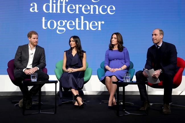 FILE - In this Wednesday, Feb. 28, 2018 file photo, Britain's Prince William and Kate, Duchess of Cambridge, with Prince Harry, left, and his fiancee Meghan Markle, second left, attend the first annual Royal Foundation Forum in London. Britain and its royal family are absorbing the tremors from a sensational television interview with Prince Harry and Meghan. The couple said they encountered racist attitudes and a lack of support that drove Meghan to thoughts of suicide. The couple gave a deeply unflattering depiction of life inside the royal household, depicting a cold, uncaring institution that they had to flee to save their lives. Meghan told Oprah Winfrey that at one point “I just didn’t want to be alive anymore.” Meghan, who is biracial, said that when she was pregnant with son Archie, there were “concerns and conversations about how dark his skin might be when he’s born.” (Chris Jackson/Pool via AP, File)