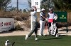 Tiger Woods tees off at the 10th hole of Albany Golf Club as Bubba Watson and his caddie look during the second round of the Hero World Challenge in Nassau, Bahamas, Thursday Dec. 5 2019. (AP Photo/Doug Ferguson)