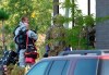 RCMP officers prepare to enter an apartment complex in connection with the mailing of ricin to President Trump, Monday, September 21, 2020 in St-Hubert, Que.,.THE CANADIAN PRESS/Ryan Remiorz