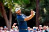 Dustin Johnson watches his drive down the ninth fairway during the final round of the RBC Heritage golf tournament in Hilton Head Island, S.C., Sunday, April 18, 2021. (AP Photo/Stephen B. Morton)