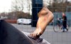 A black cloth used to hide the vandalized statue of Zlatan Ibrahimovic uncovers a bronze foot from the block of stone, outside the stadium of Malmo's soccer team in Malmo, Sweden, Thursday, Jan. 16, 2020. Two feet are all that remains of the local hero and one of Sweden's greatest ever sports stars. After a series of attacks by vandals, the statue is holed up in a secret location undergoing repairs. (AP Photo/David Keyton)