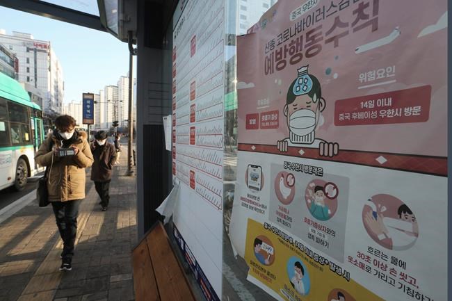 A poster detailing precautions to take against the coronavirus is seen at a bus station in Goyang, South Korea, Sunday, Feb. 23, 2020. South Korea's president has put the country on its highest alert for infectious diseases and says officials should take