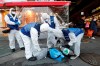Workers wearing protective gears prepare to spray disinfectant as a precaution against the coronavirus at a market in Seoul, South Korea, Monday, Feb. 24, 2020. South Korean President Moon Jae-in said his government had increased its anti-virus alert level by one notch to “Red,” the highest level. It allows for the temporary closure of schools and reduced operation of public transportation and flights to and from South Korea. (AP Photo/Ahn Young-joon)