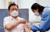 South Korean President Moon Jae-in, left, receives his second dose of the AstraZeneca COVID-19 vaccine at a health care center in Seoul, South Korea, Friday, April 30, 2021. (Lee Jin-wook/Yonhap via AP)
