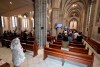 Catholics attends a mass while maintaining social distancing to help curb the spread of the coronavirus at the Myeongdong Cathedral in Seoul, South Korea, Sunday, May 17, 2020. (Lee Jung-hoon/Yonhap via AP)