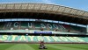 A worker trims the grass on the field at the Jeonju World Cup Stadium in Jeonju, South Korea, Thursday, May 7, 2020. South Korea's soccer league will kick off the season Friday, three days after the first pitch was thrown in baseball, in yet another sign that life in the country is starting to return to normal after strenuous efforts to contain the coronavirus.(Kim Orel/Newsis via AP)
