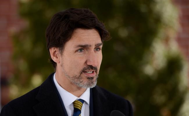 Prime Minister Justin Trudeau addresses Canadians on the COVID-19 pandemic from Rideau Cottage in Ottawa on Friday, March 27, 2020. THE CANADIAN PRESS/Sean Kilpatrick