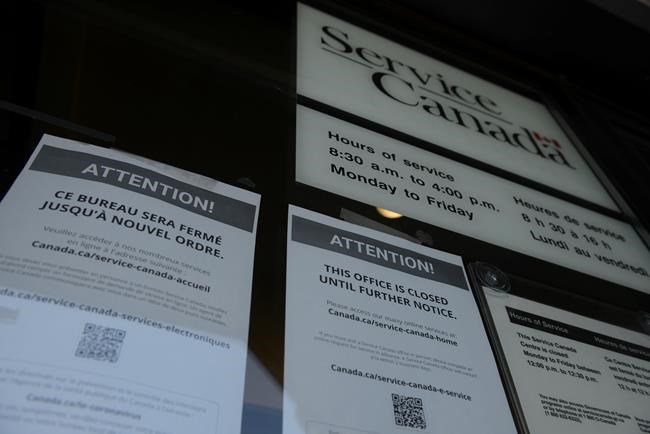 A sign posted on the window of a Service Canada Centre notifies people that it is closed until further notice in Carleton Place, Ont., on Friday, March 27, 2020. The Canadian Government has closed all centres due to the COVID-19 pandemic. THE CANADIAN PRESS/Sean Kilpatrick