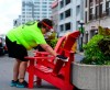 An employee disinfects a public chair in the Byward Market in downtown Ottawa on Monday, Aug. 17, 2020. THE CANADIAN PRESS/Sean Kilpatrick