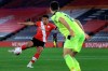 Southampton's Che Adams, left, scores the opening goal during the English Premier League soccer match between Southampton and Newcastle United in Southampton, England, Friday, Nov. 6, 2020. (Adam Davy/Pool Photo via AP)