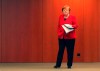German Chancellor Angela Merkel waits for the beginning of a press conference in Berlin, Germany, Wednesday, May 6, 2020 after an online meeting of Merkel and the German state governors on the loosening of the restictions to reduce the spread of the new coronavirus. (AP Photo/Michael Sohn, pool)