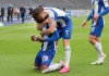 Berlin's Dodi Lukebakio, left, celebrates his goal with team mate Berlin's Krzysztof Piatek during a German Bundesliga soccer match between Hertha BSC Berlin and Bayer Leverkusen in Berlin, Germany, Saturday, June 20, 2020. (AP Photo/Michael Sohn, Pool)