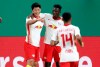 Leipzig's Hwang Hee-chan, left, celebrates after scoring his side's second goal during the German soccer cup, DFB Pokal, quarter final match between RB Leipzig and VfL Wolfsburg in Leipzig, Germany, Wednesday, March 3, 2021. (AP Photo/Michael Sohn)