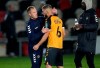 Newport's manager Michael Flynn, left, comforts Newport's Brandon Cooper, center, after the EFL Cup 4th round soccer match between Newport County and Newcastle United in Newport, Wales, Wednesday, Sept. 30, 2020. (Nick Potts/Pool via AP)